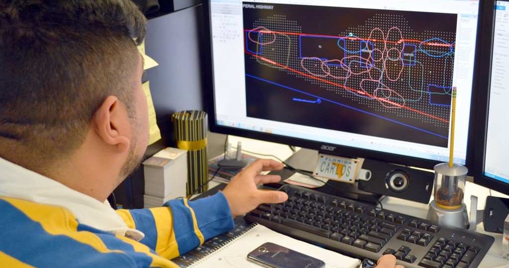 Applications Engineer, Carlos Alvarenga, works on a lighting layout for DECO.